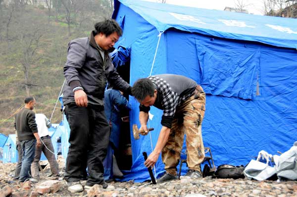 Relief work after fire in ancient village