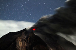 People clear volcanic ash in Indonesia