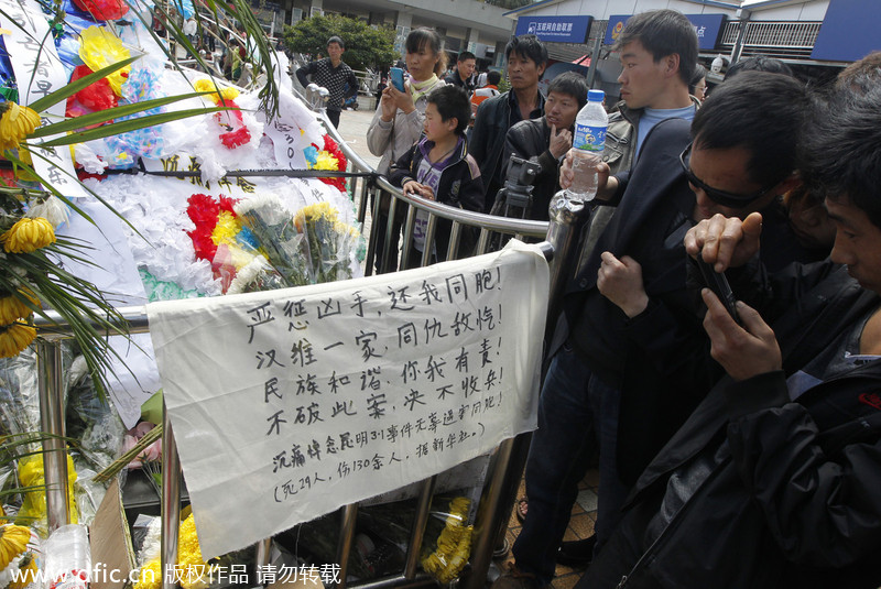 Monks mourn the dead in Kunming terror attack