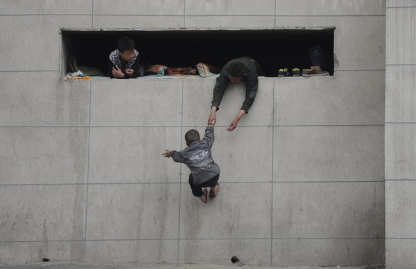 Street children live in hole in a wall in NE China