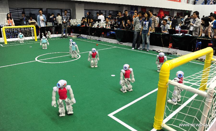 Robots kick off soccer match in E China