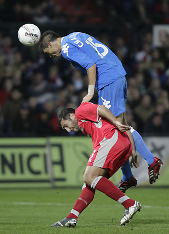 Feyenoord's Angelos Charisteas (top) fights for the ball with Blackburn Rovers' Zurab Khizanishvili during their UEFA Cup Group E soccer match at the Kuip Stadium in Rotterdam, the Netherlands November 23, 2006. 