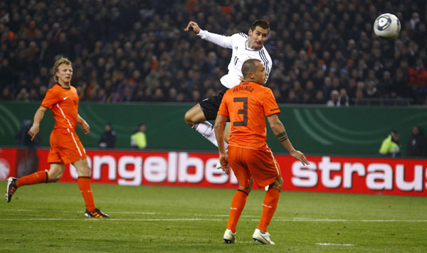 Klose closes on record as Germans crush Dutch