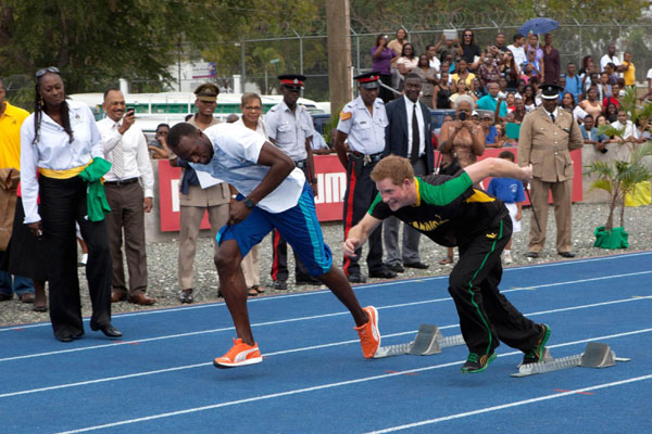 Prince Harry runs with Usain Bolt in Jamaica