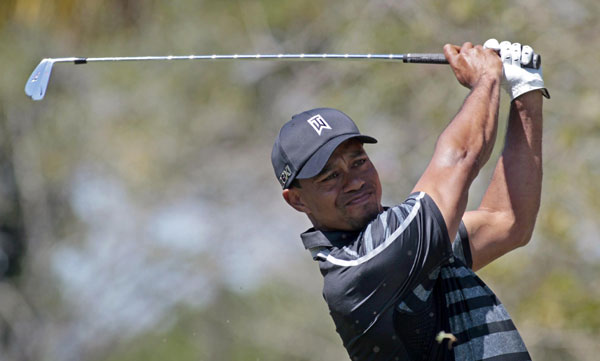 Tiger gets by with a little help from his friend