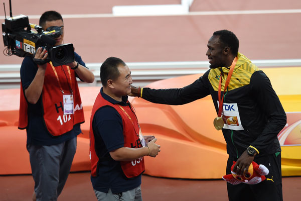 Bolt 'somersaults' after cameraman takes him down