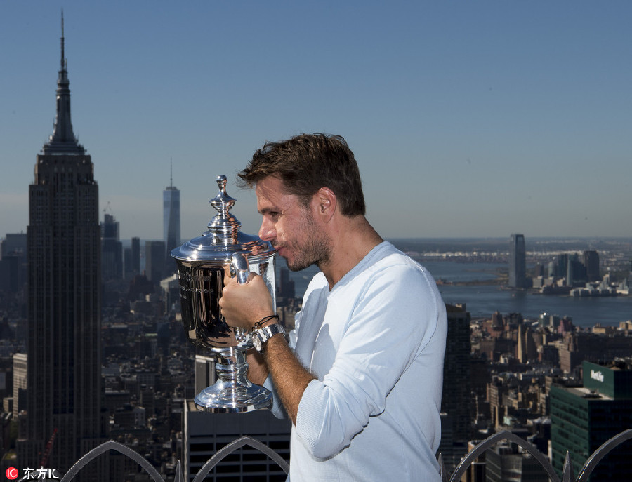 Wawrinka climbs 'top of the rock' for celebration