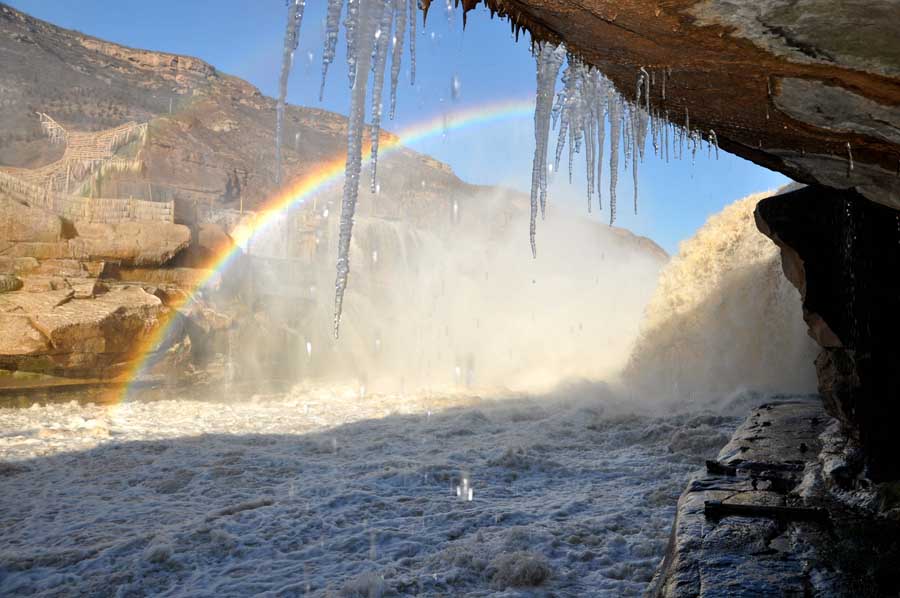 Rainbow arches over Hukou Waterfalls in N China