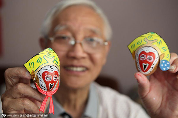 Senior paints intricate masks on eggshells