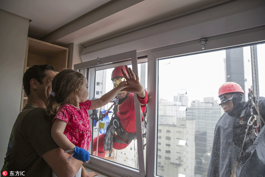 Superheroes cheer up sick children in Sao Paulo