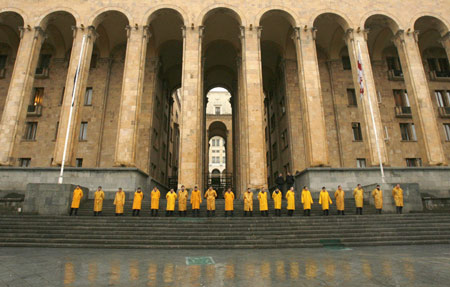 Police officers stand guard in front of the parliament building in central Tbilisi, Nov. 7, 2007. Georgian police armed with batons on Wednesday broke up a six-day protest outside parliament calling for the resignation of pro-U.S. President Mikhail Saakashvili, but opposition leaders vowed defiance and called on supporters to rally again.