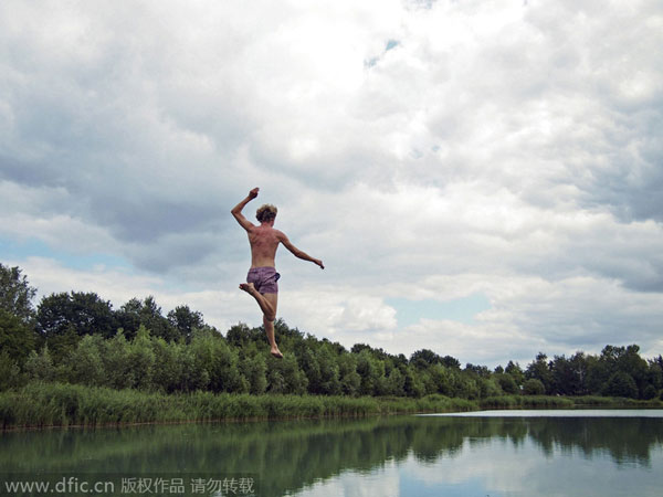 Catapulting into air to dive in lake