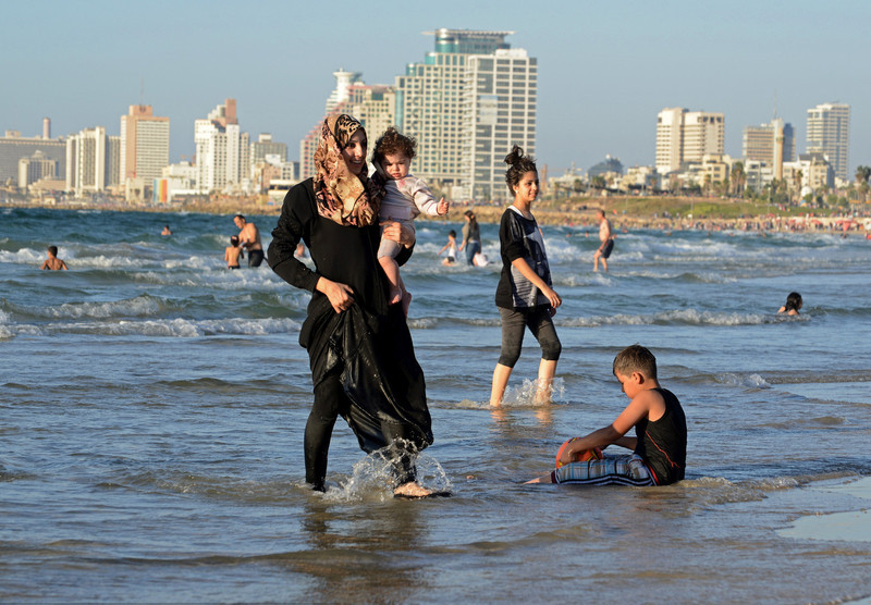 Palestinian Muslims enjoy Mediterranean Sea