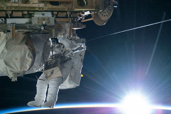 US astronauts complete second spacewalk, water reported in helmet