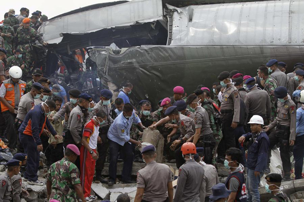 Military plane crashes into residential area in Indonesia