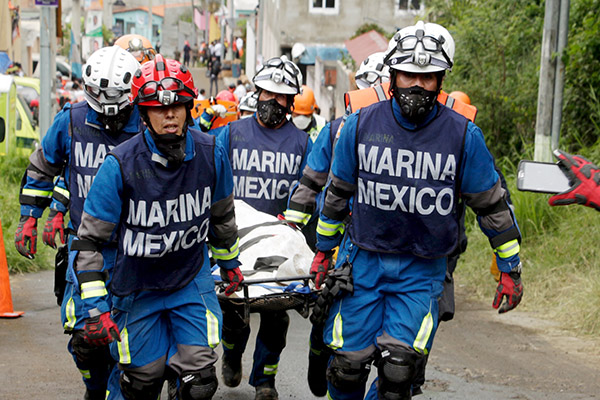 Families mourn victims of Guatemala landslide, hundreds feared dead