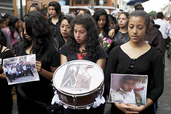 Families mourn victims of Guatemala landslide, hundreds feared dead