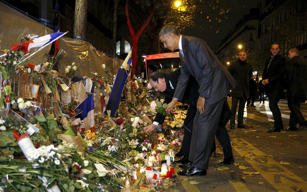 Obama visits Paris attack site, pays tribute to victims