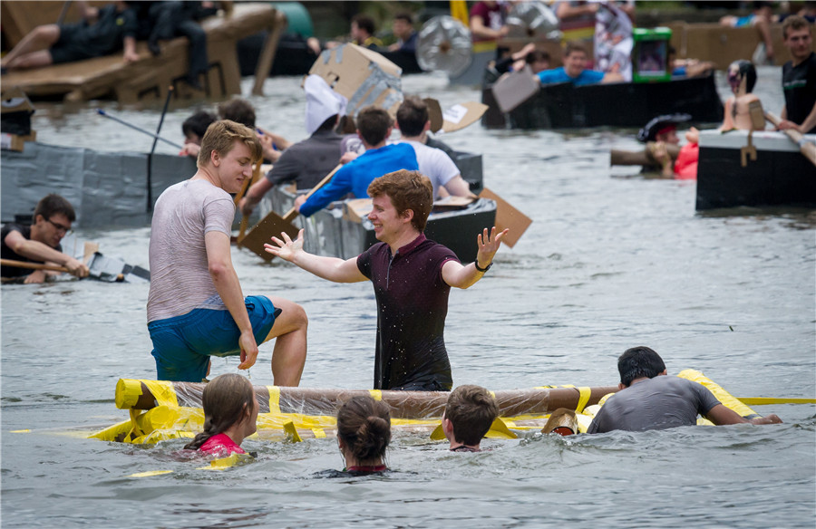 Cambridge students celebrate end of exams with cardboard boat race